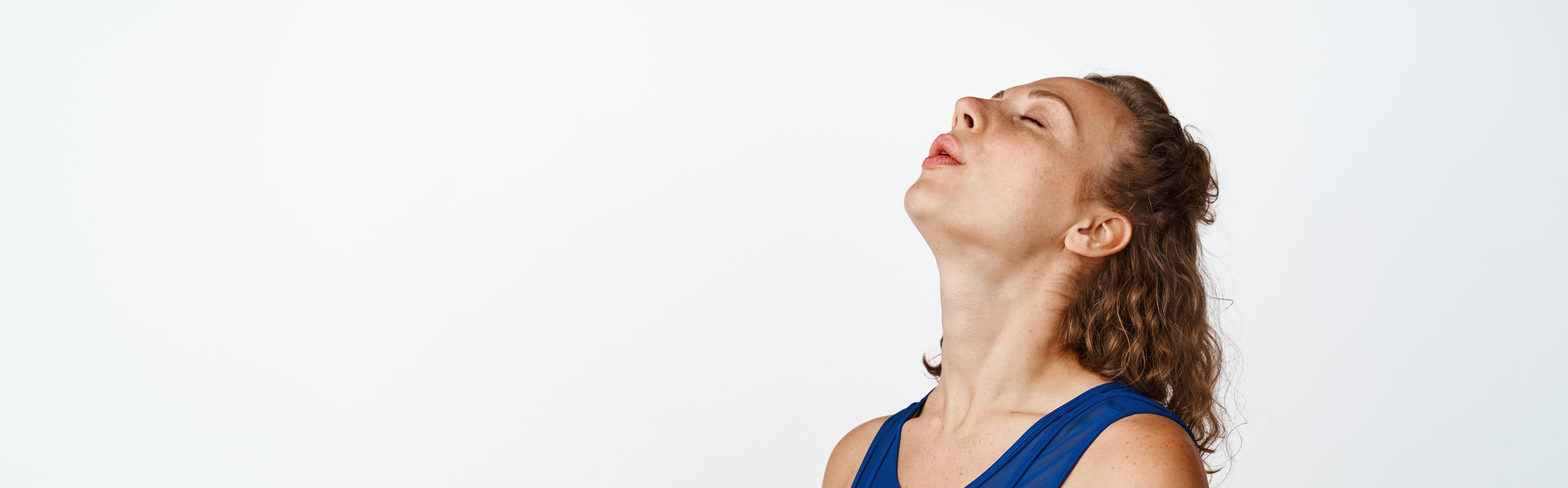 Young Fitness Woman Exhaling Looking Tired After Workout Sportswoman Breathing Hard After Jogging Wearing Activewear Standing White (4)